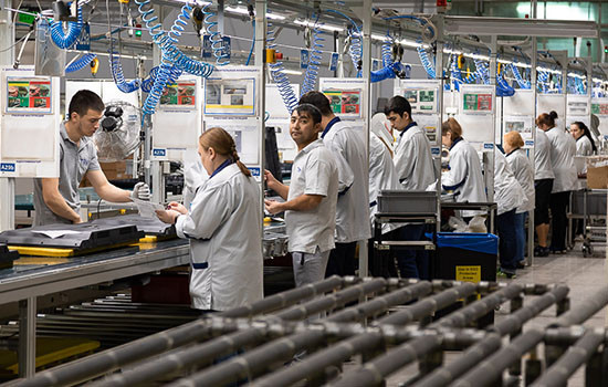 WORKER AT A CAR PARTS FACTORY