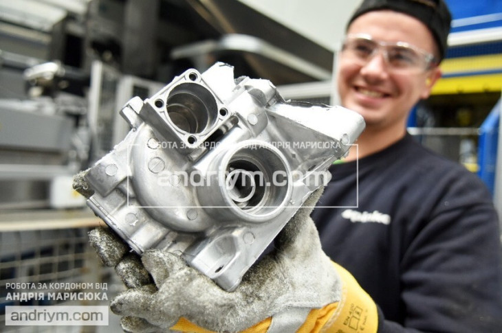 Worker at aluminum parts production