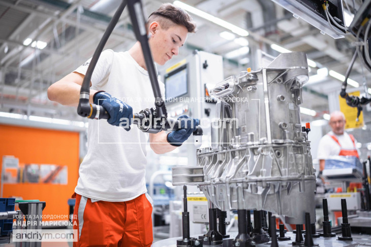 Worker at electric motor production