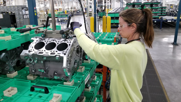 Worker at electric vehicle parts production