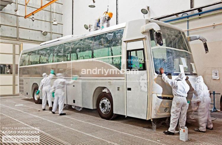 Worker at a bus manufacturing plant